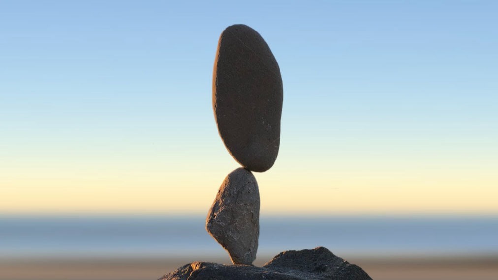 Picture of a key about to unlock a door